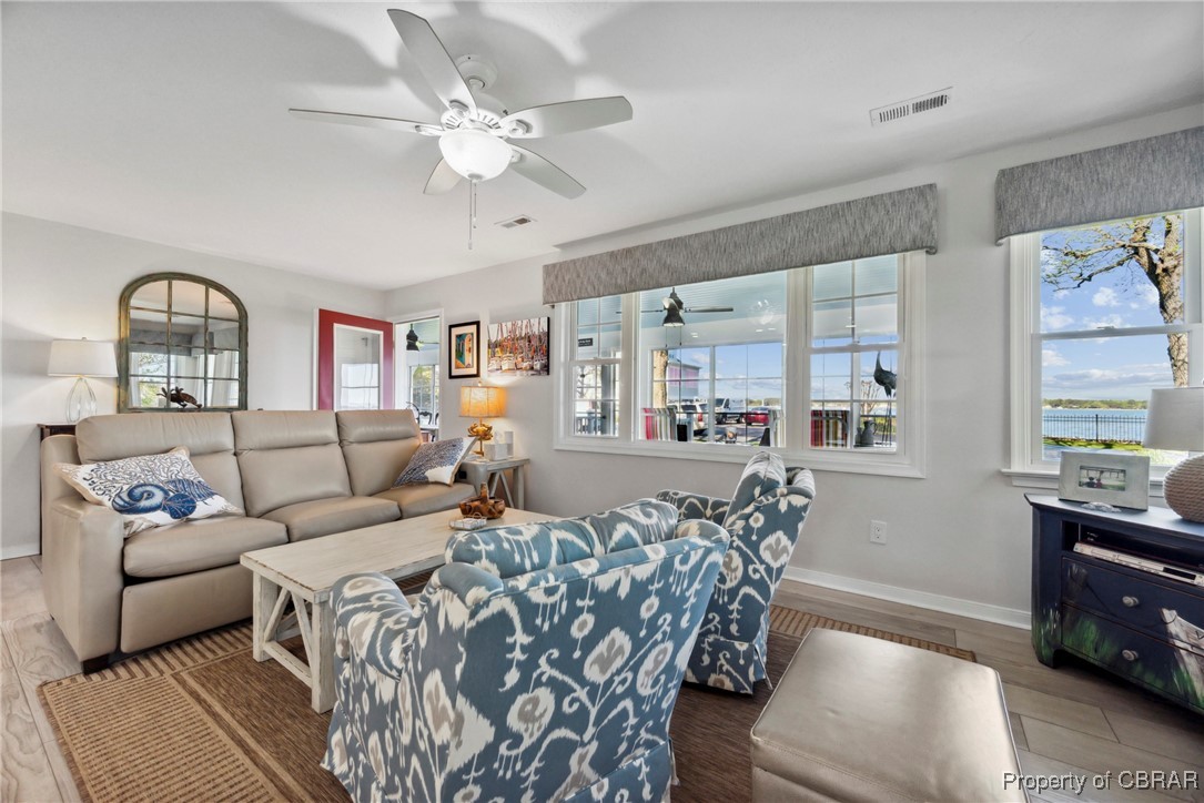 298 Old Ferry Road Hudgins, VA 23076 - Photo 7 of 48 Living area with ceiling fan, baseboards, LVP floors,