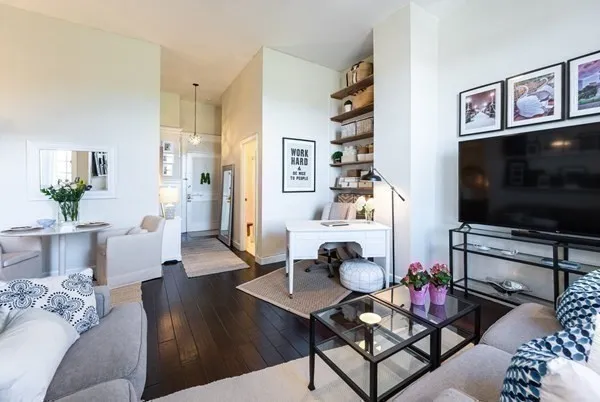 a living room with furniture and a flat screen tv