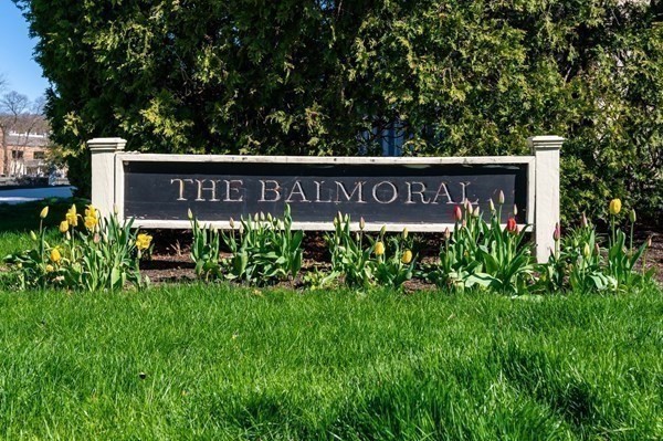 16 Balmoral Street, Unit 410 Andover, MA 01810 - Photo 2 of 34 a sign that is sitting in front of flowers
