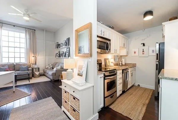 a kitchen with a sink stove and refrigerator