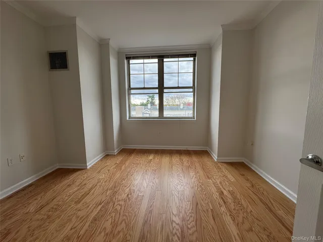 a view of room with window and wardrobe