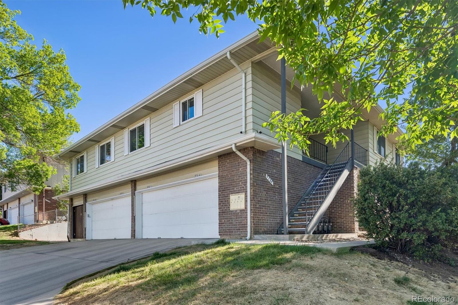 9768 Lane Street Thornton, CO 80260 - Photo 1 of 18 a view of backyard of house with green space