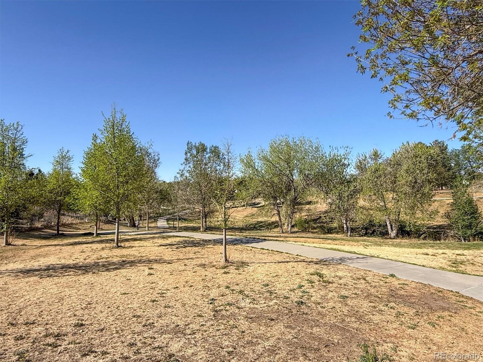 9768 Lane Street Thornton, CO 80260 - Photo 17 of 18 a view of road yard and trees
