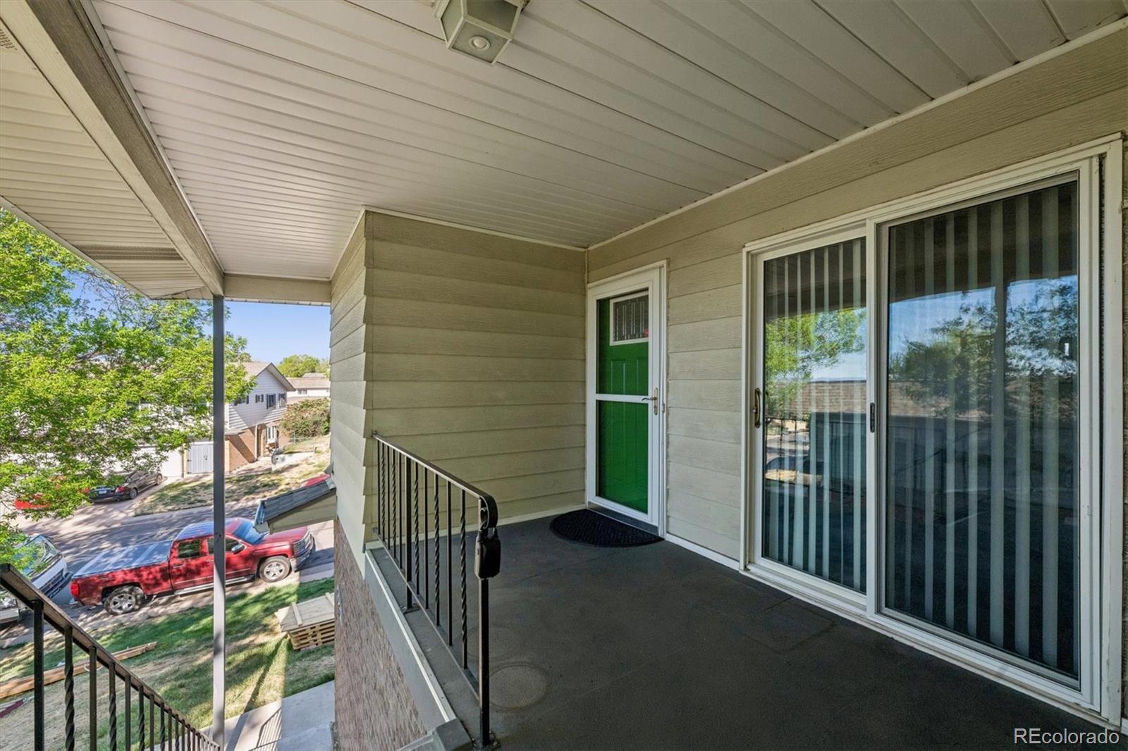 9768 Lane Street Thornton, CO 80260 - Photo 2 of 18 a view of balcony