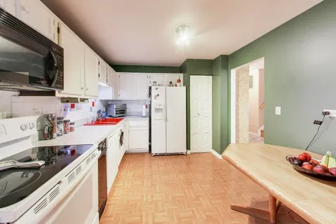 a storage room with wooden floor and window