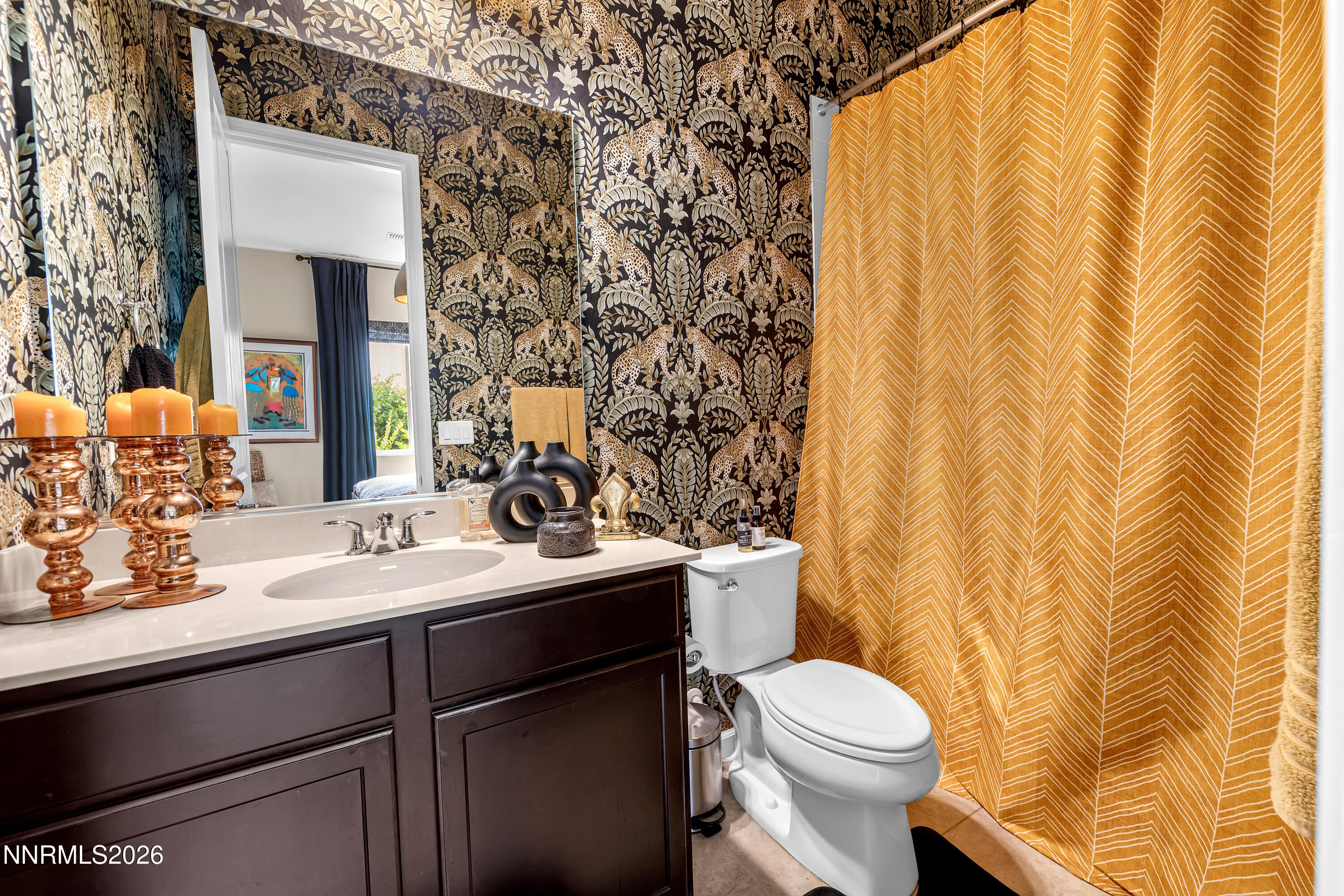 9021 Iron Sky Court Reno, NV 89523 - Photo 20 of 39 a bathroom with a sink a toilet and a mirror