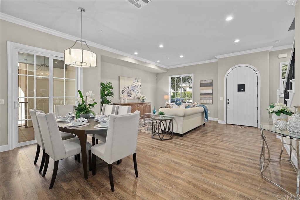 1015 Holly Avenue, Unit B Arcadia, CA 91007 - Photo 15 of 39 a living room with furniture dining table and a chandelier