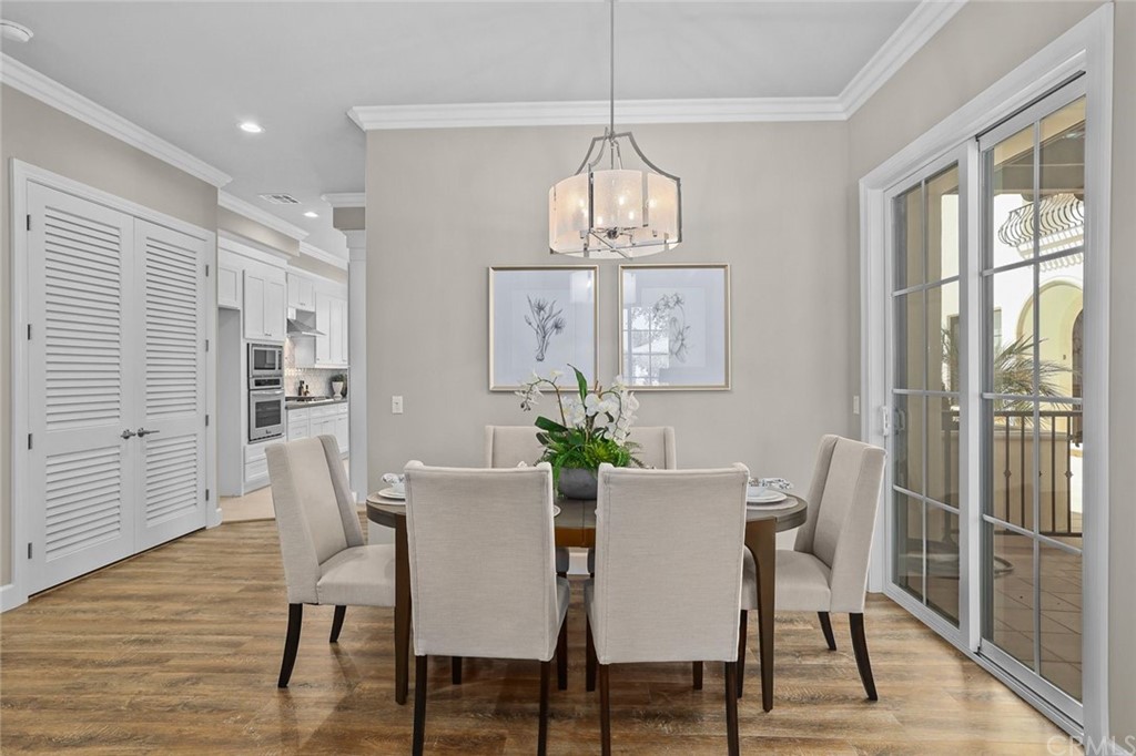 1015 Holly Avenue, Unit B Arcadia, CA 91007 - Photo 16 of 39 a view of a dining room with furniture wooden floor and chandelier