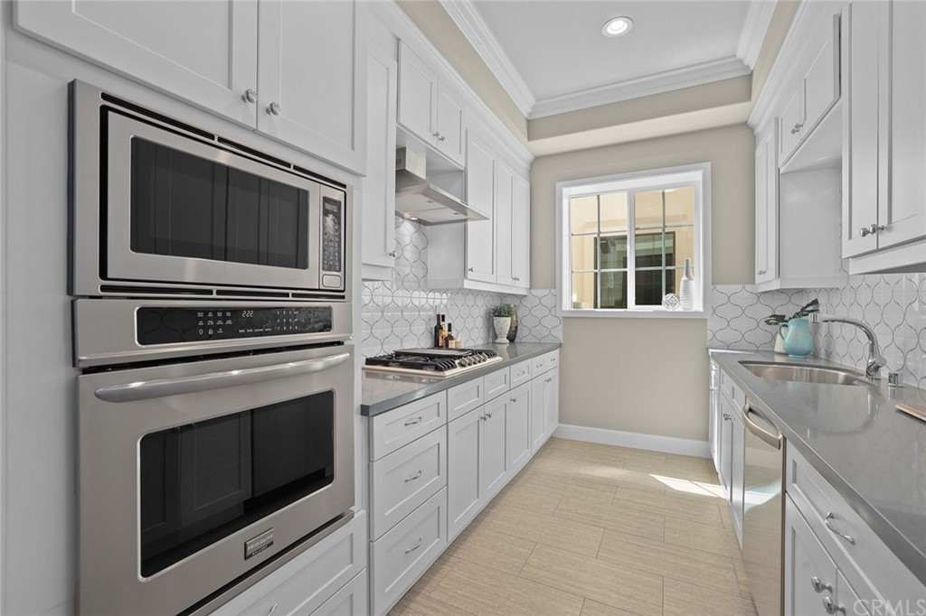 1015 Holly Avenue, Unit B Arcadia, CA 91007 - Photo 17 of 39 a kitchen with granite countertop cabinets stainless steel appliances and a window