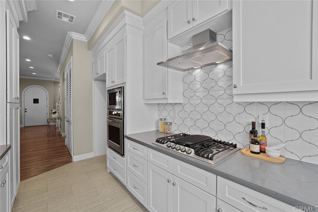 1015 Holly Avenue, Unit B Arcadia, CA 91007 - Photo 18 of 39 a kitchen with stainless steel appliances granite countertop a stove a refrigerator and a white cabinets
