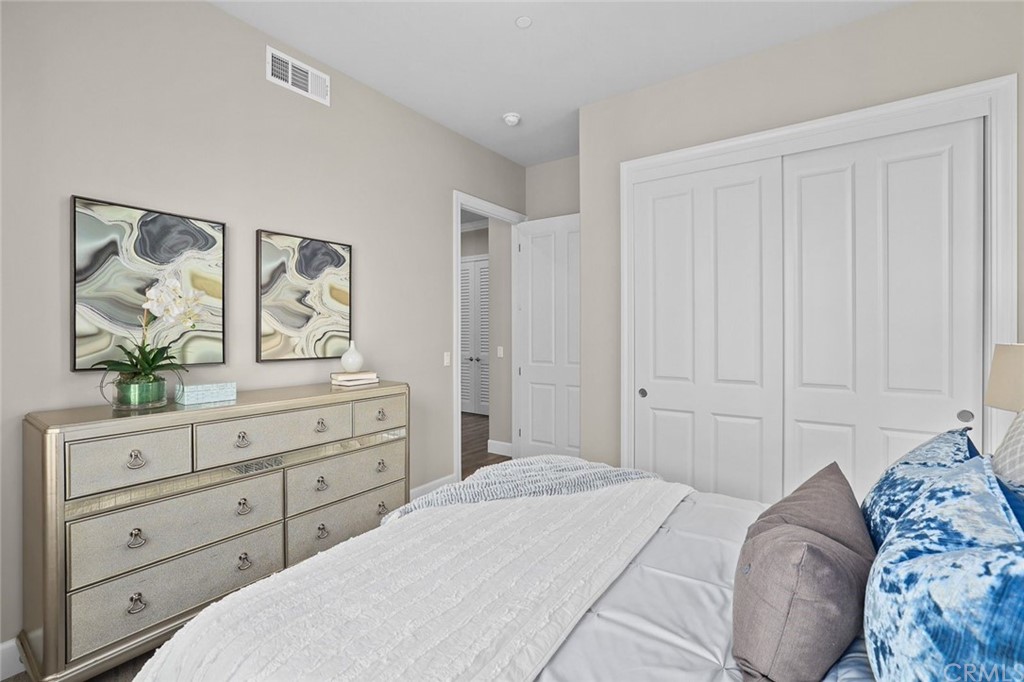 1015 Holly Avenue, Unit B Arcadia, CA 91007 - Photo 21 of 39 a bedroom with a bed and a dresser in it