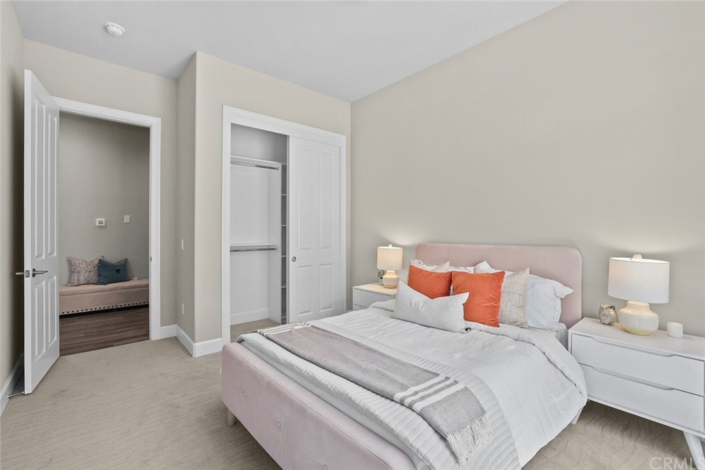 1015 Holly Avenue, Unit B Arcadia, CA 91007 - Photo 24 of 39 a bedroom with a bed and a lamp