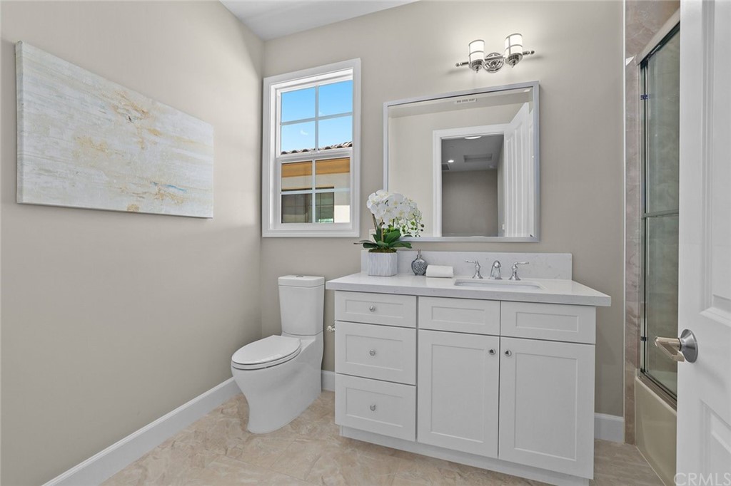 1015 Holly Avenue, Unit B Arcadia, CA 91007 - Photo 25 of 39 a bathroom with a toilet sink and mirror