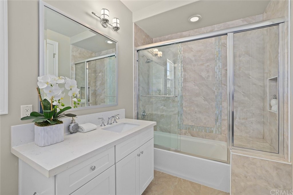1015 Holly Avenue, Unit B Arcadia, CA 91007 - Photo 26 of 39 a bathroom with a sink tub shower and a mirror