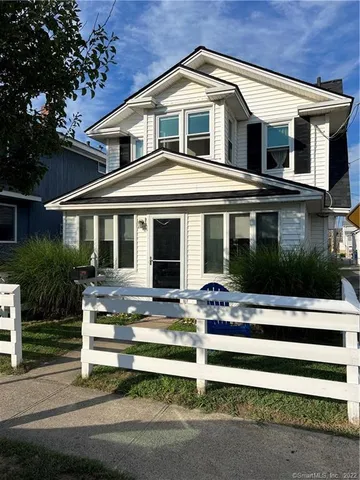 a front view of a house with a porch