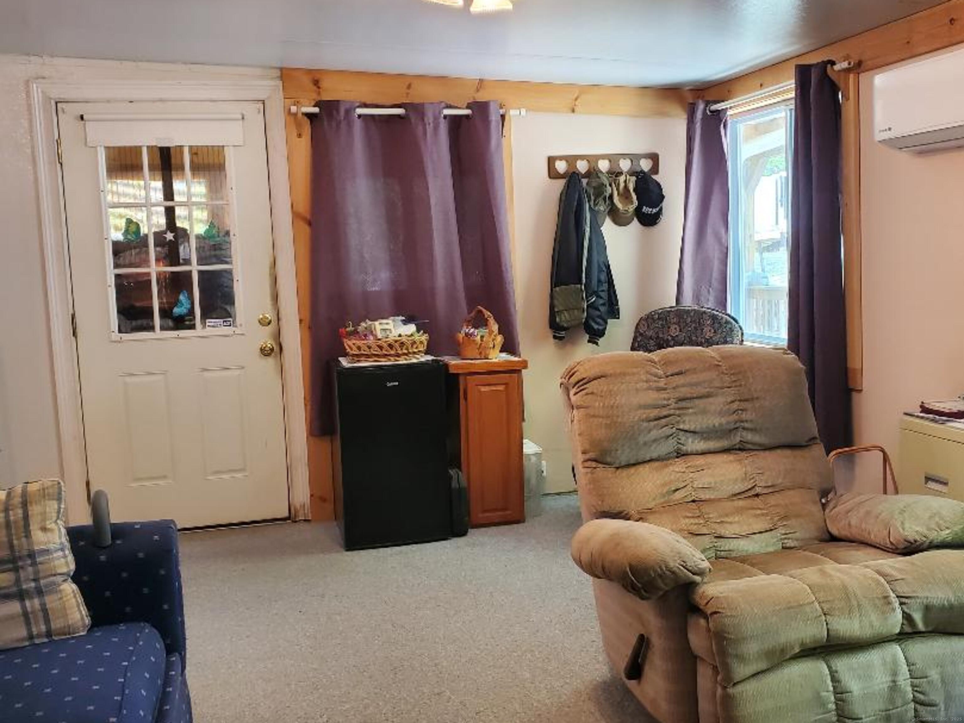 8 S Road, Unit WW4 Stafford, CT 06076 - Photo 11 of 23 a living room with furniture and a window