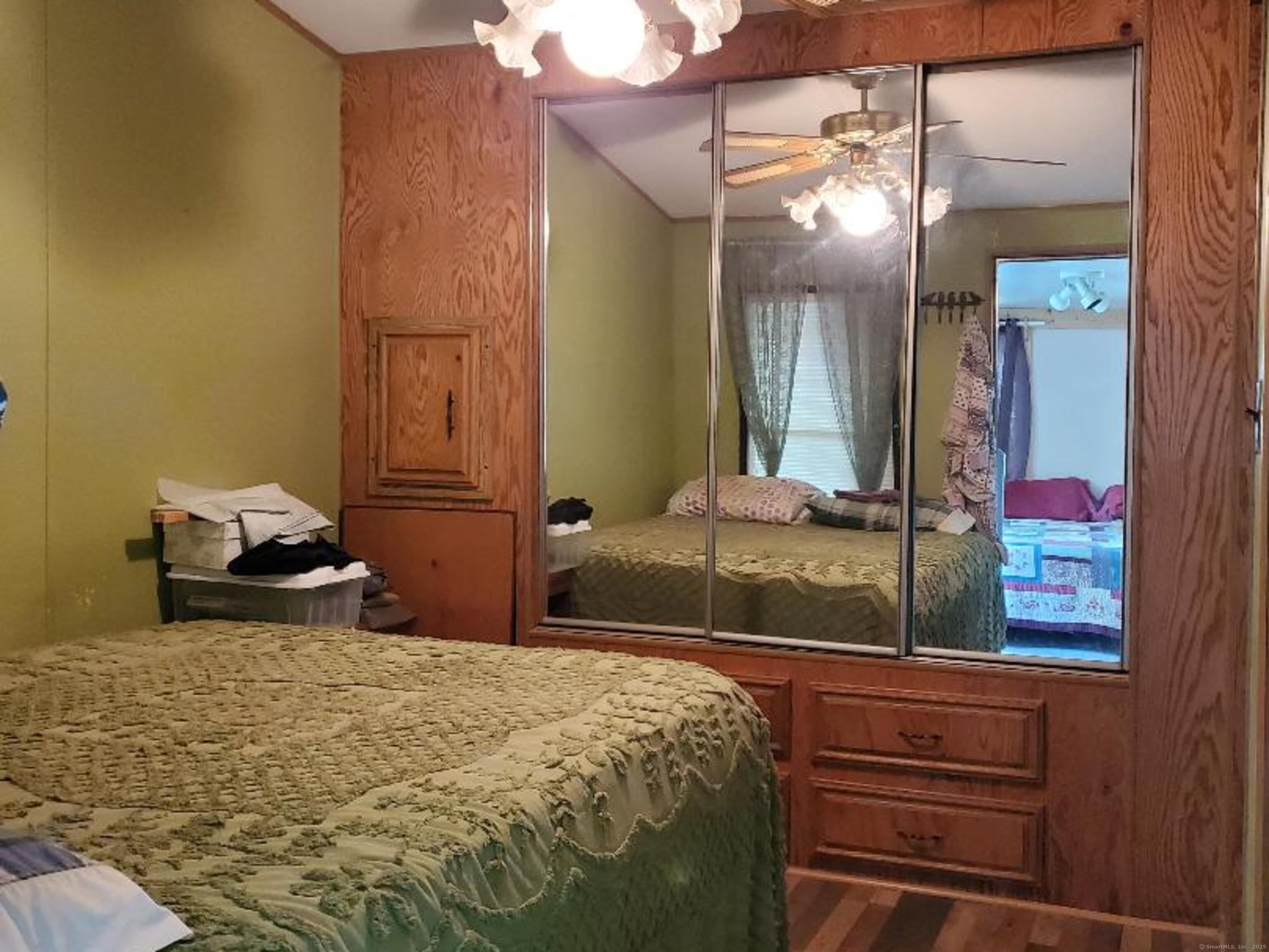 8 S Road, Unit WW4 Stafford, CT 06076 - Photo 16 of 23 a bedroom with a bed and a mirror