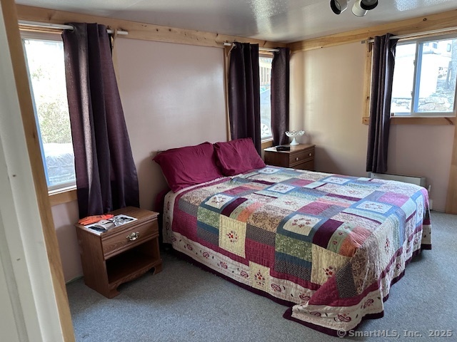 8 S Road, Unit WW4 Stafford, CT 06076 - Photo 18 of 23 a bedroom with a bed and a window