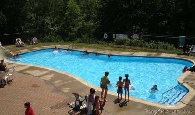 8 S Road, Unit WW4 Stafford, CT 06076 - Photo 21 of 23 a view of a swimming pool with an outdoor seating