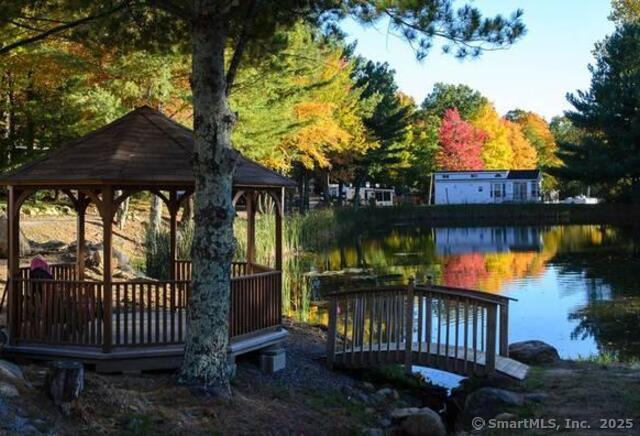8 S Road, Unit WW4 Stafford, CT 06076 - Photo 22 of 23 a view of a bench in patio