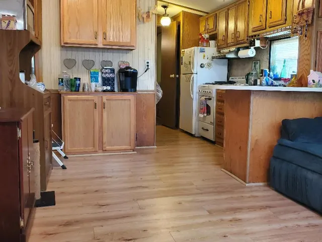 a view of a dining room with furniture and window