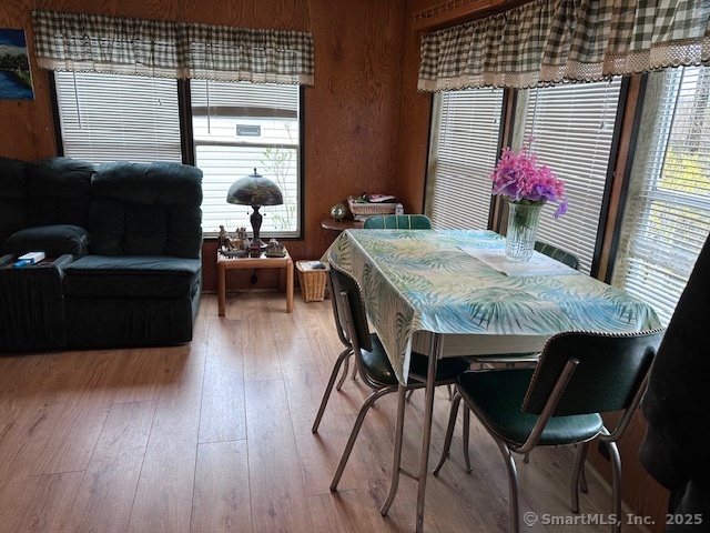 8 S Road, Unit WW4 Stafford, CT 06076 - Photo 8 of 23 a dining room with furniture and wooden floor