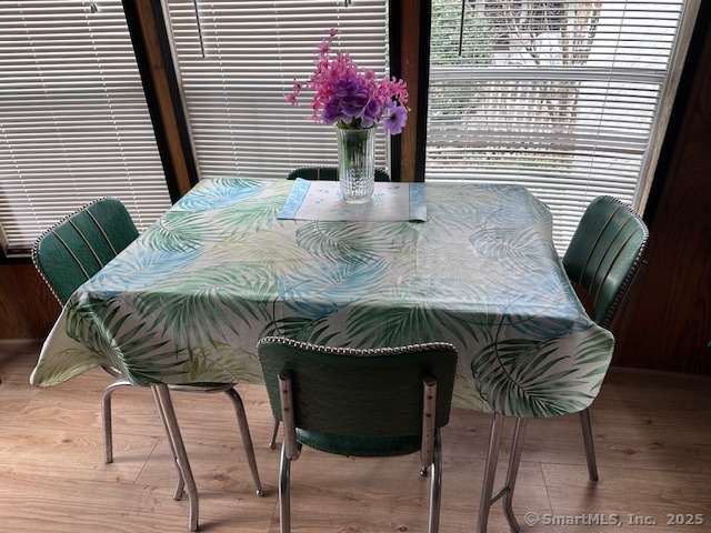 8 S Road, Unit WW4 Stafford, CT 06076 - Photo 9 of 23 a view of a dining room with furniture and wooden floor