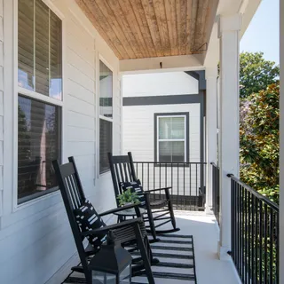 a view of a patio with a table and chairs