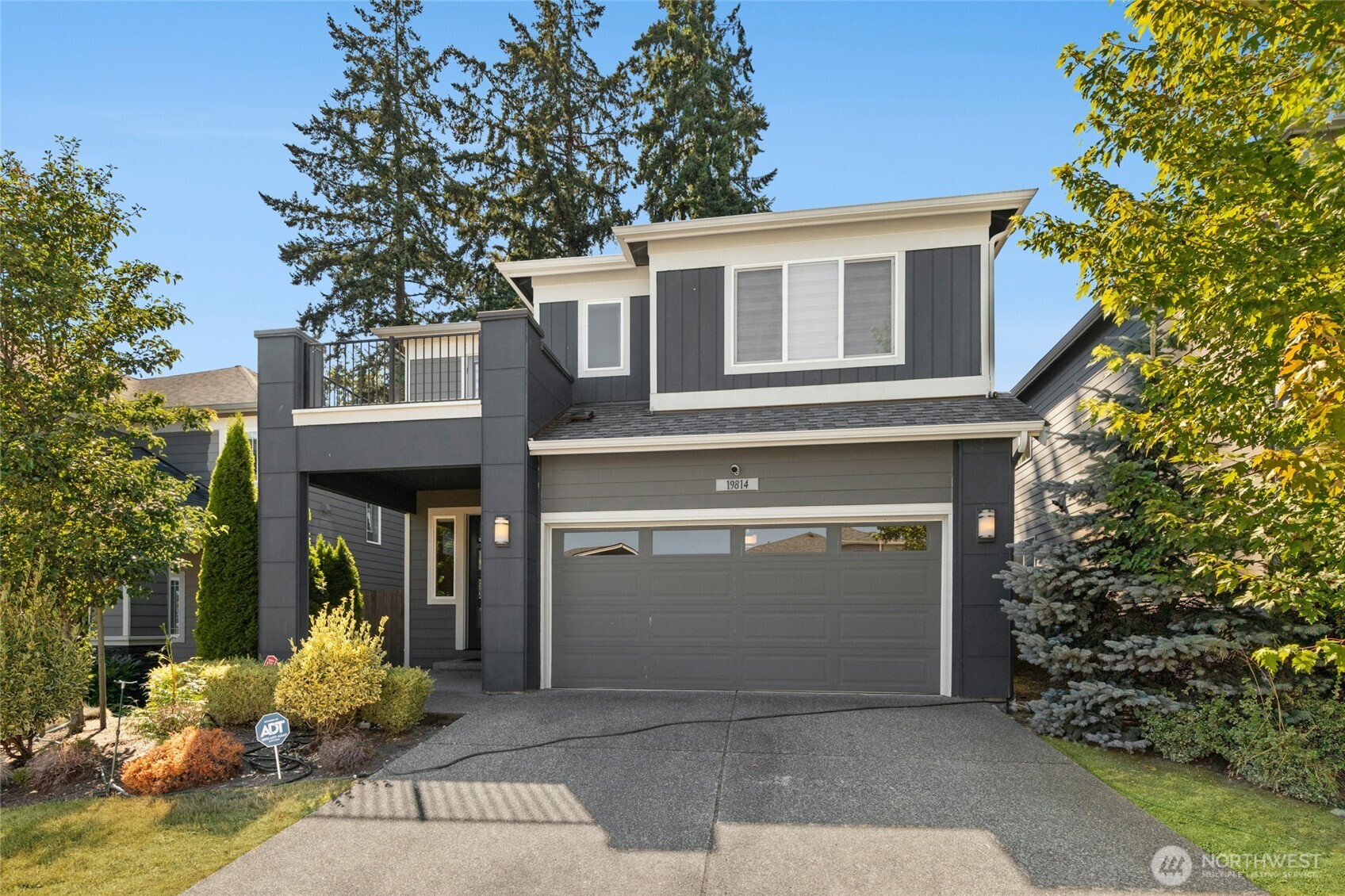 19814 11th Drive Southeast Bothell, WA 98012 - Photo 1 of 32 a front view of a house with patio