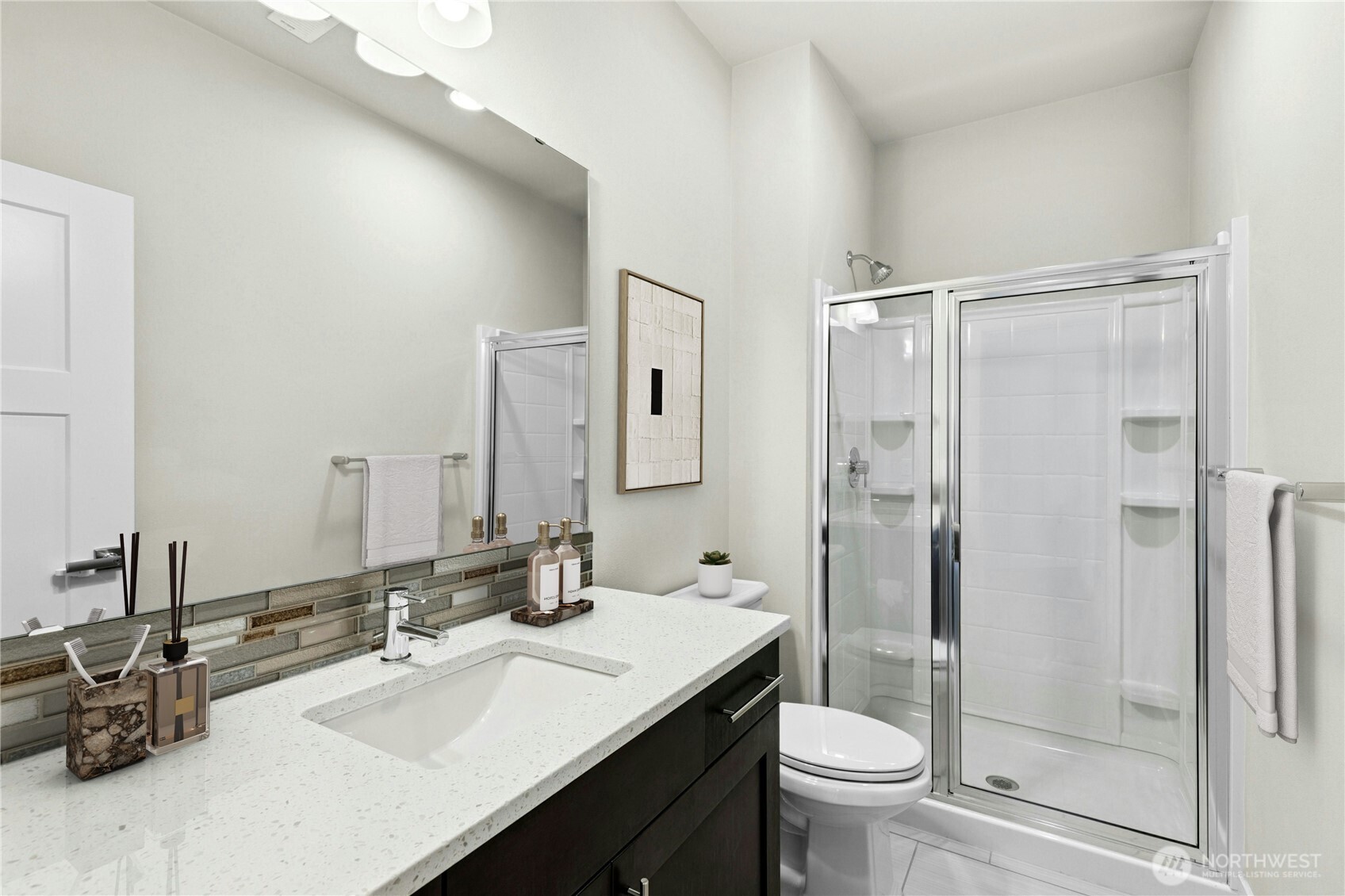 19814 11th Drive Southeast Bothell, WA 98012 - Photo 13 of 32 a bathroom with a sink a toilet and shower