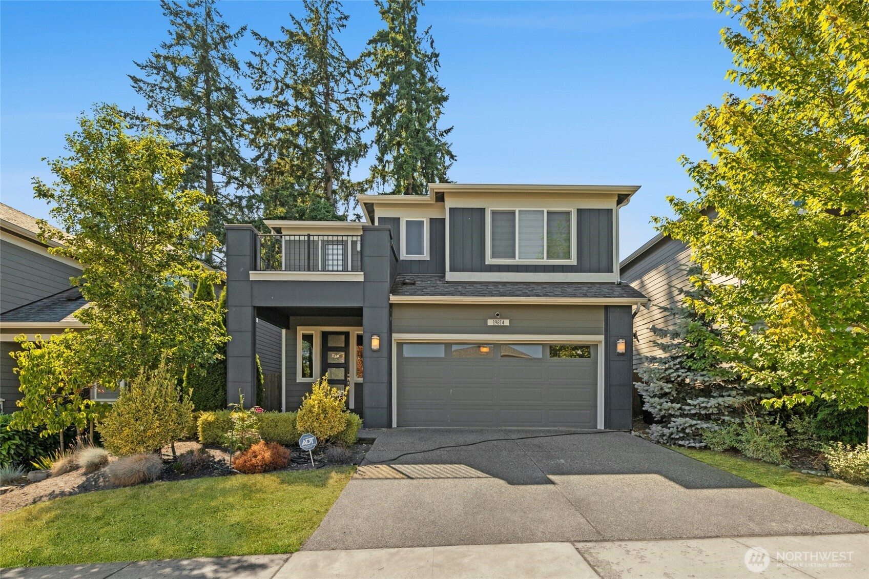 19814 11th Drive Southeast Bothell, WA 98012 - Photo 2 of 32 a front view of a house with garden