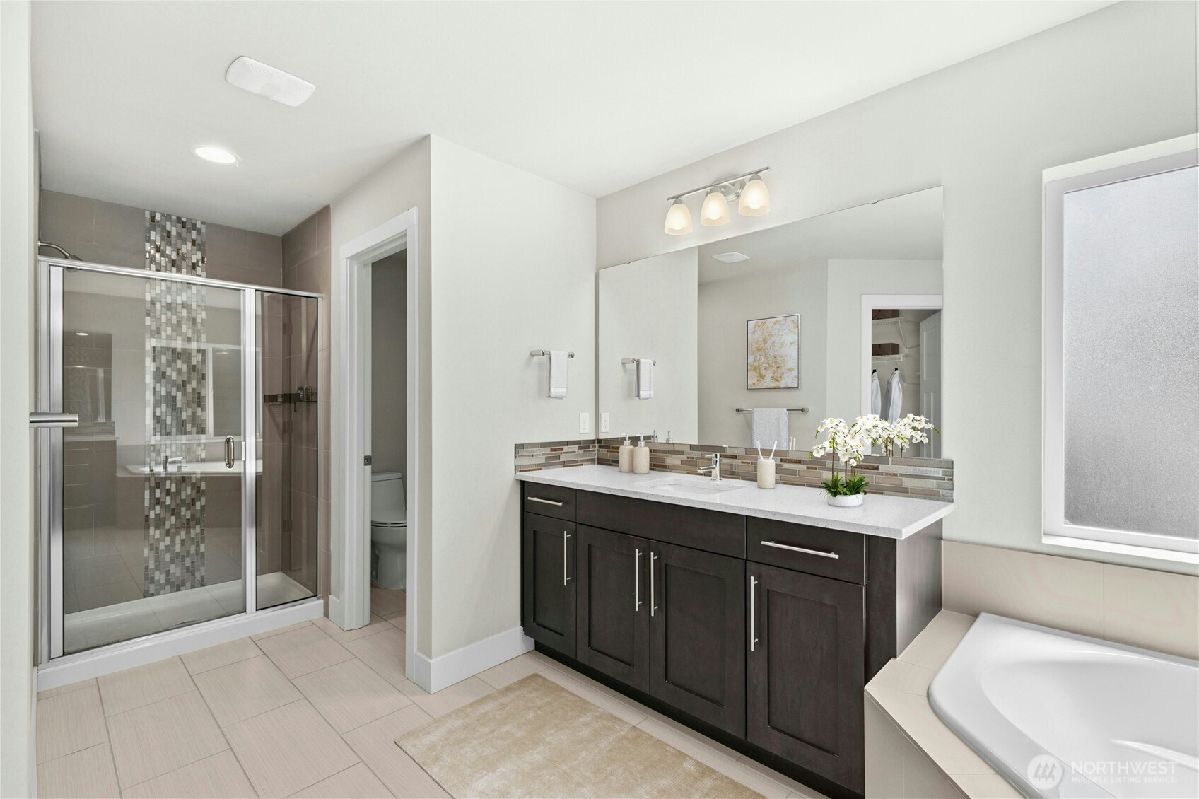 19814 11th Drive Southeast Bothell, WA 98012 - Photo 23 of 32 a spacious bathroom with a granite countertop sink mirror and shower
