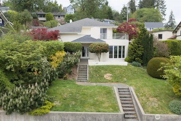 a aerial view of a house with yard