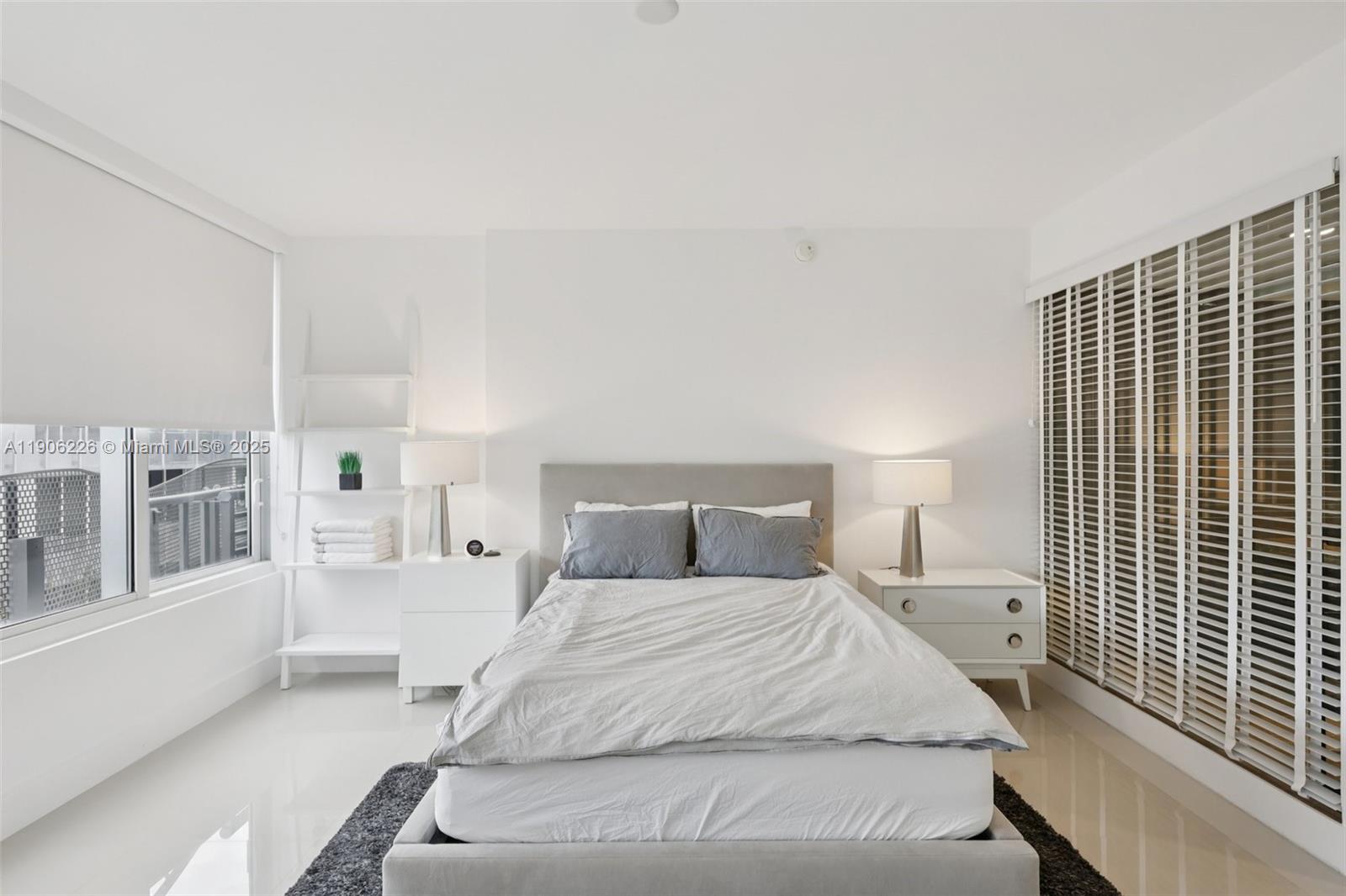 2155 Washington Court, Unit 303 Miami Beach, FL 33139 - Photo 15 of 35 a large white bed in a white room