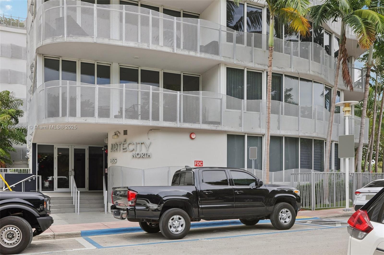 2155 Washington Court, Unit 303 Miami Beach, FL 33139 - Photo 2 of 35 a car parked in front of a building