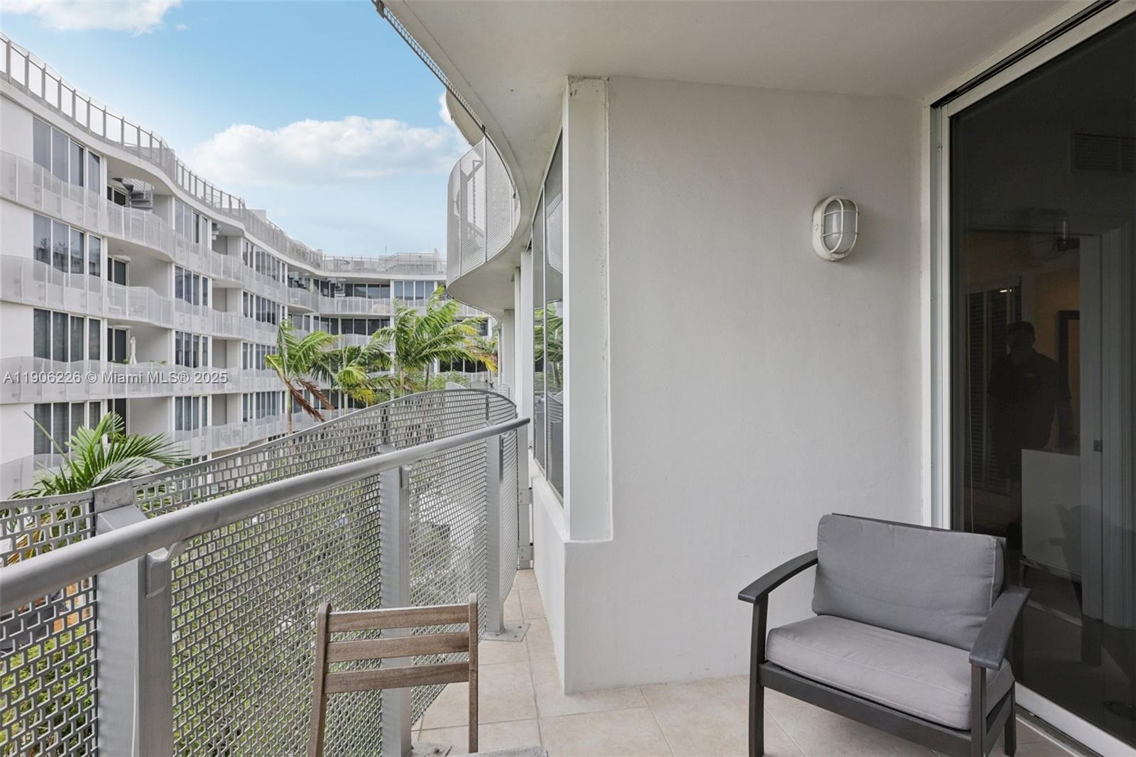 2155 Washington Court, Unit 303 Miami Beach, FL 33139 - Photo 31 of 35 a balcony view with outdoor seating and plants