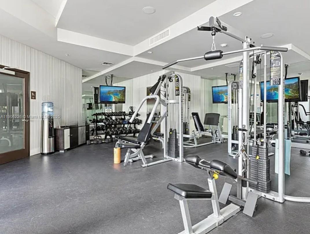 2155 Washington Court, Unit 303 Miami Beach, FL 33139 - Photo 34 of 35 a view of a room with gym equipment
