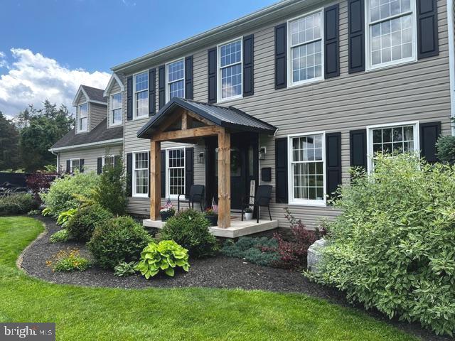 16621 Lappans Road Williamsport, MD 21795 - Photo 5 of 79 a front view of a house with a garden and porch