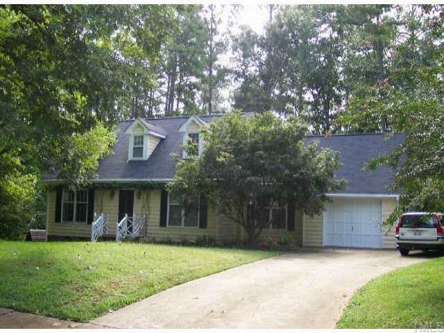 5021 Knaresborough Road Raleigh, NC 27612 - Photo 1 of 1 a front view of a house with a yard and garage