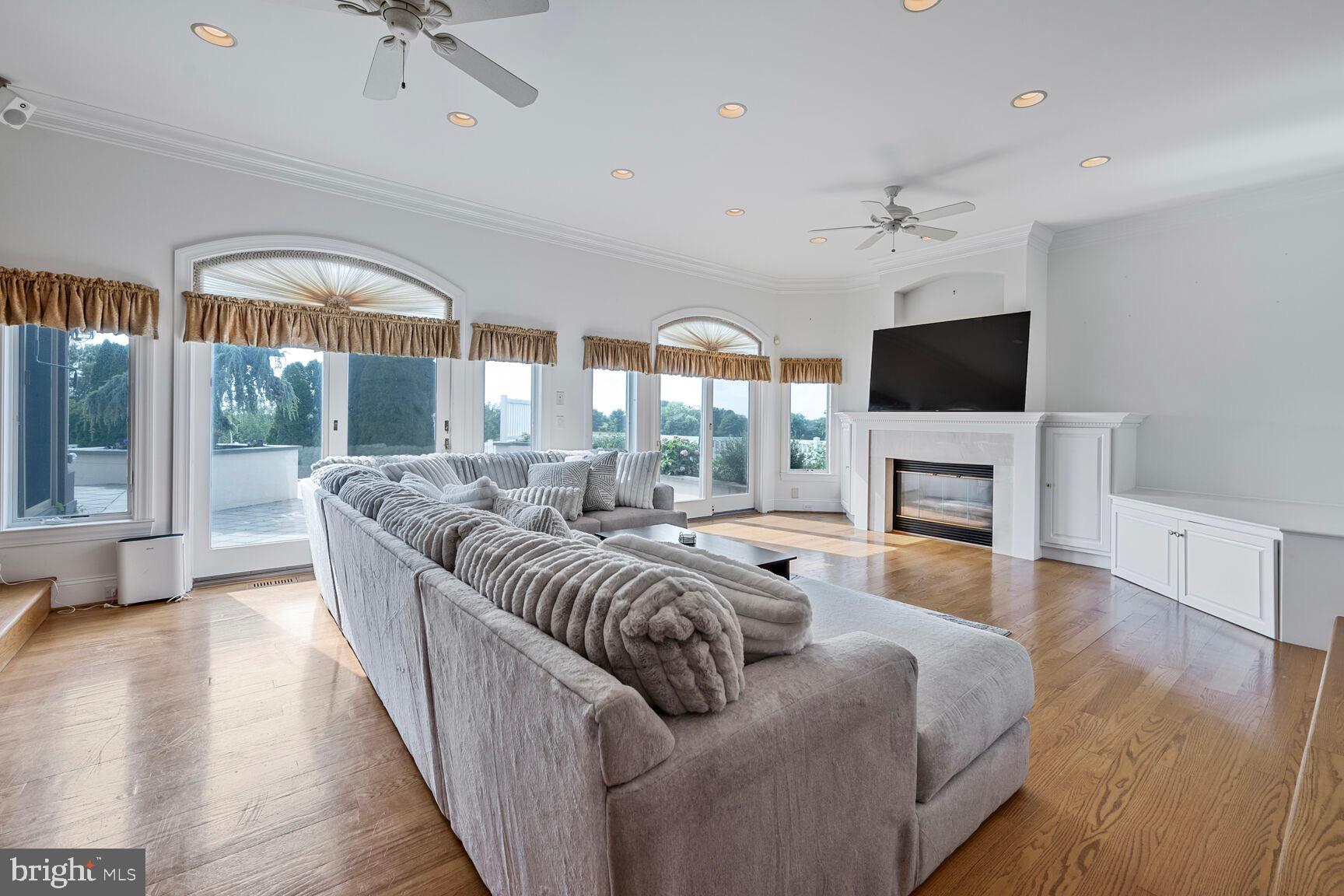 230 Point Airy Road Pilesgrove, NJ 08098 - Photo 14 of 78 a living room with furniture large window and a flat screen tv