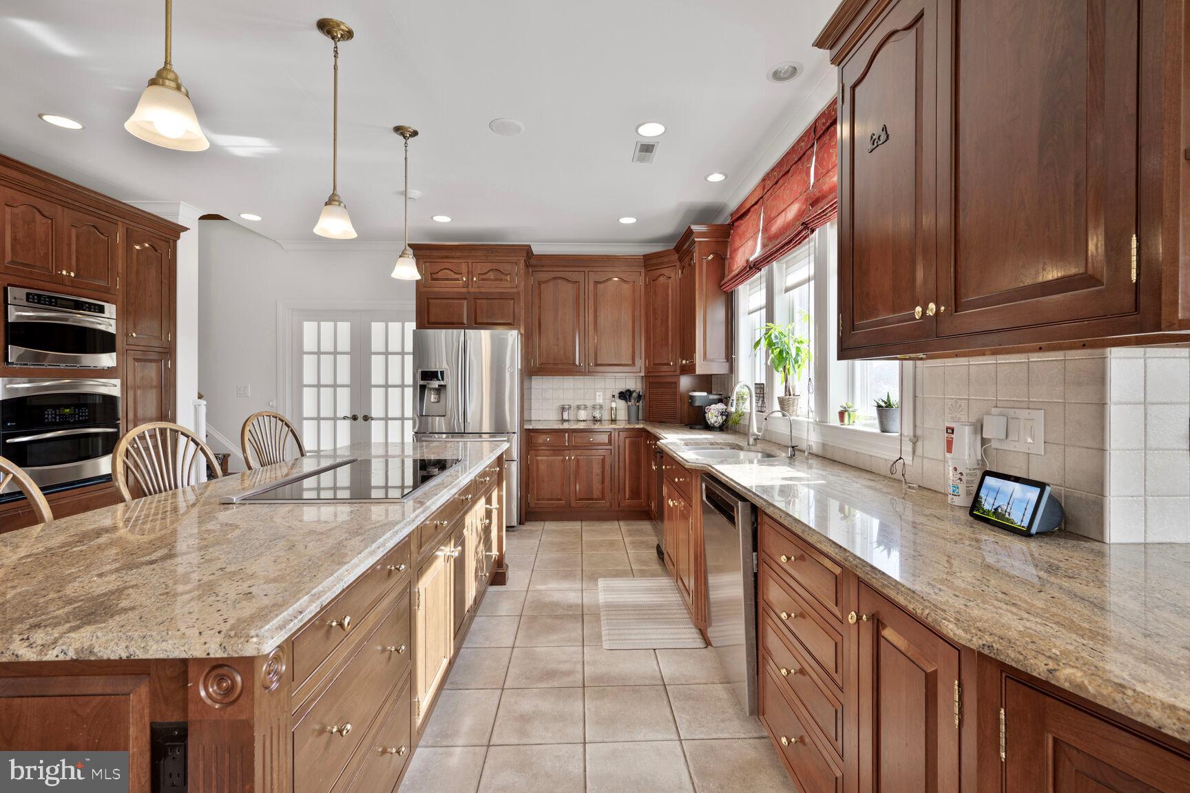 230 Point Airy Road Pilesgrove, NJ 08098 - Photo 34 of 78 a kitchen with stainless steel appliances granite countertop a sink a stove and a wooden floors