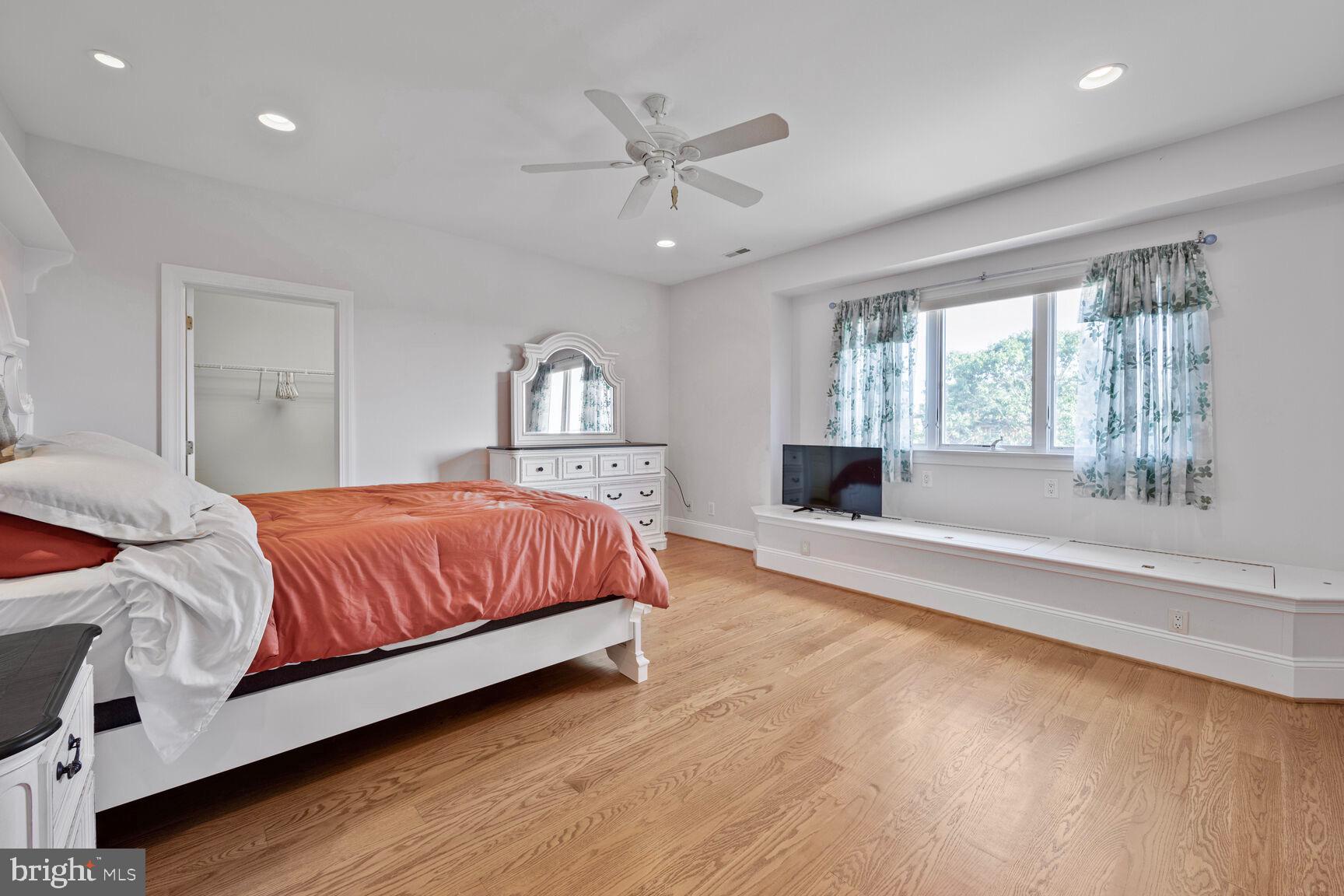230 Point Airy Road Pilesgrove, NJ 08098 - Photo 49 of 78 a spacious bedroom with a large bed and a chandelier