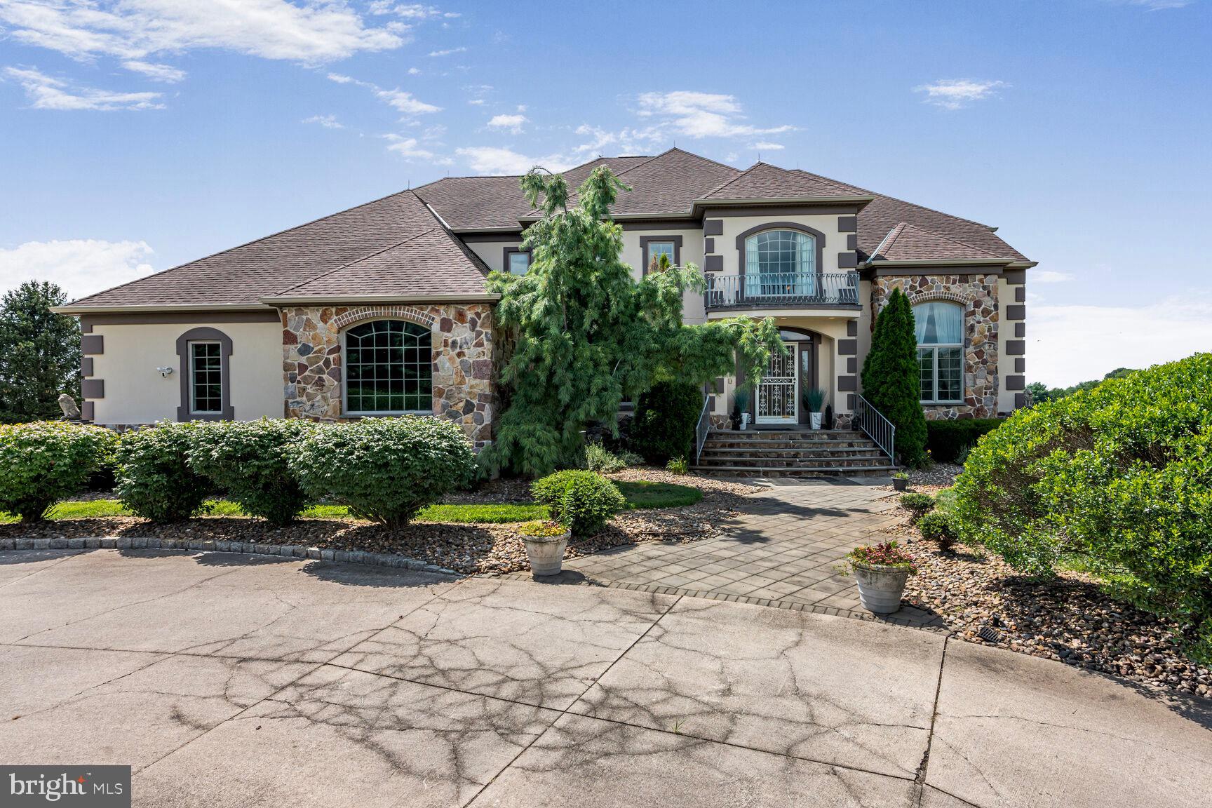 230 Point Airy Road Pilesgrove, NJ 08098 - Photo 7 of 78 a front view of a house with garden