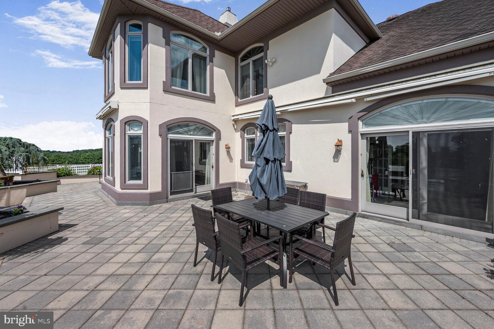 230 Point Airy Road Pilesgrove, NJ 08098 - Photo 74 of 78 a view of a patio with table and chairs