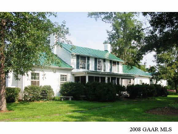 6001 White Bridge Road Waynesboro, VA 22980 - Photo 1 of 1 a front view of a house with a garden