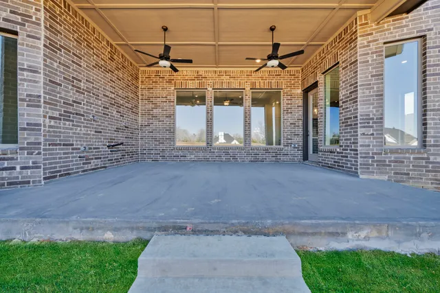 a view of a brick house with a street