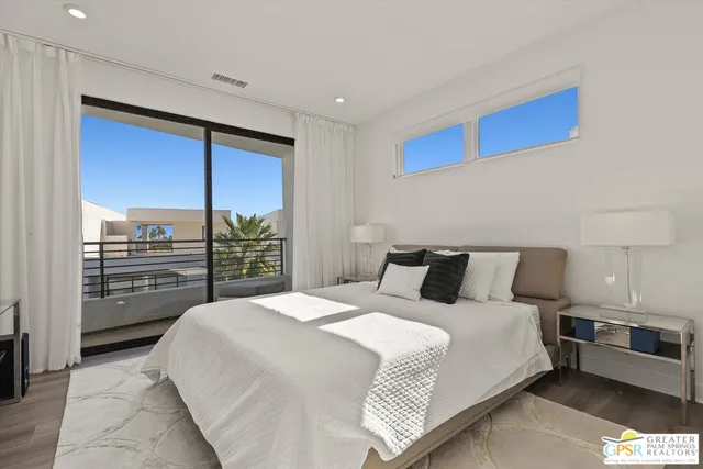 a bedroom with a large bed and a closet