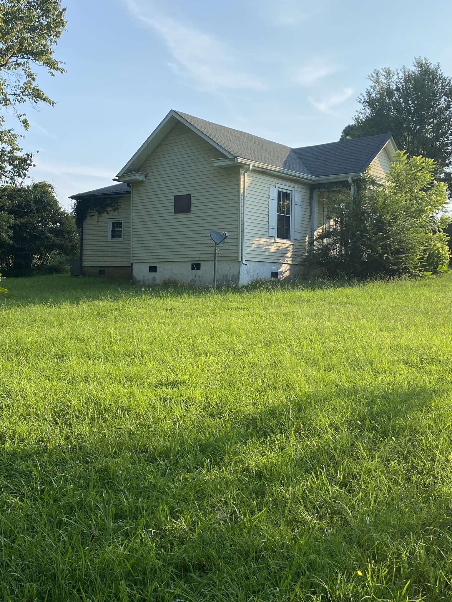 972 Fall River Road Goodspring, TN 38460 - Photo 20 of 31 a front view of a house with garden