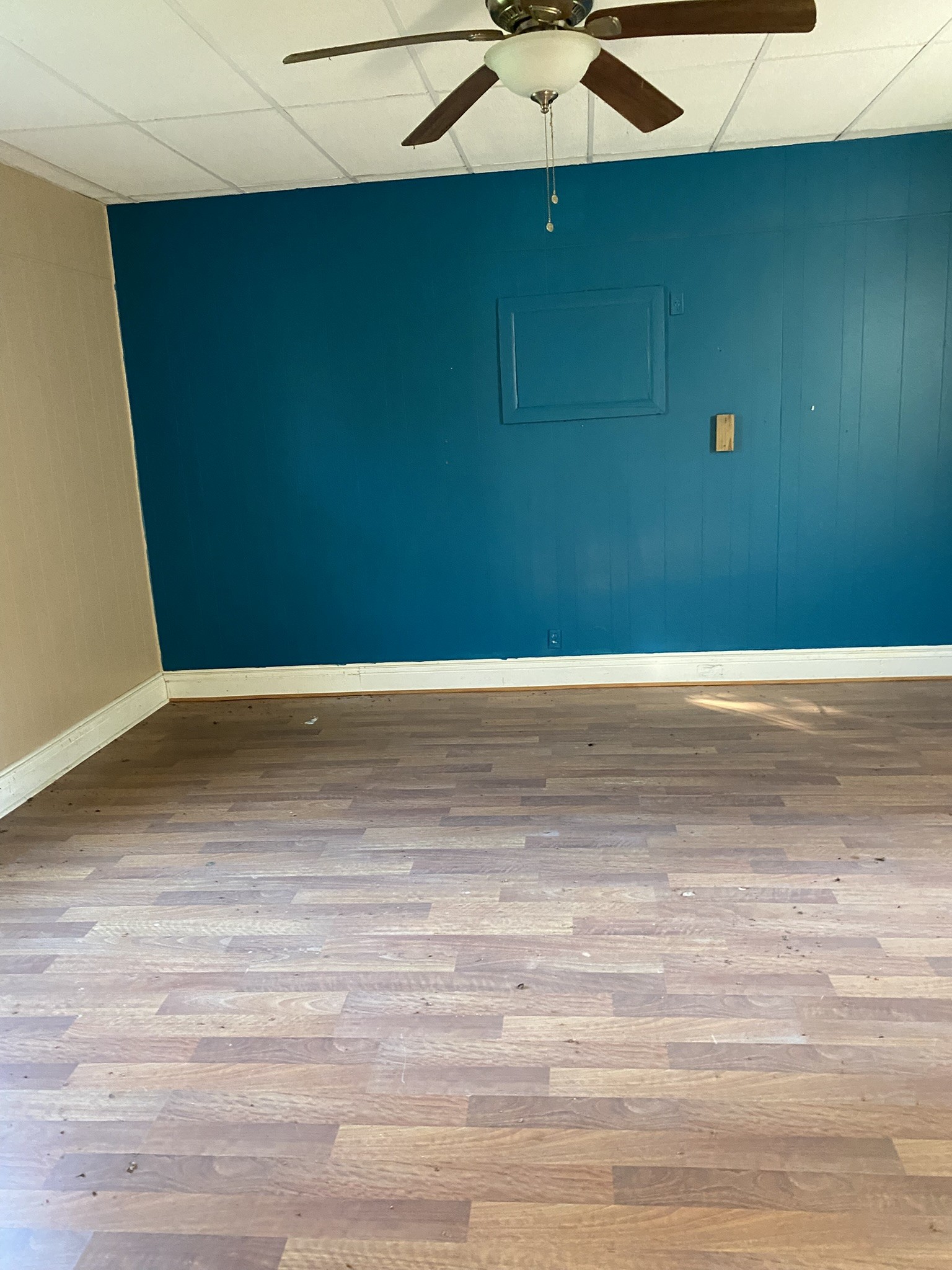 972 Fall River Road Goodspring, TN 38460 - Photo 23 of 31 an empty room with wooden floor and fan