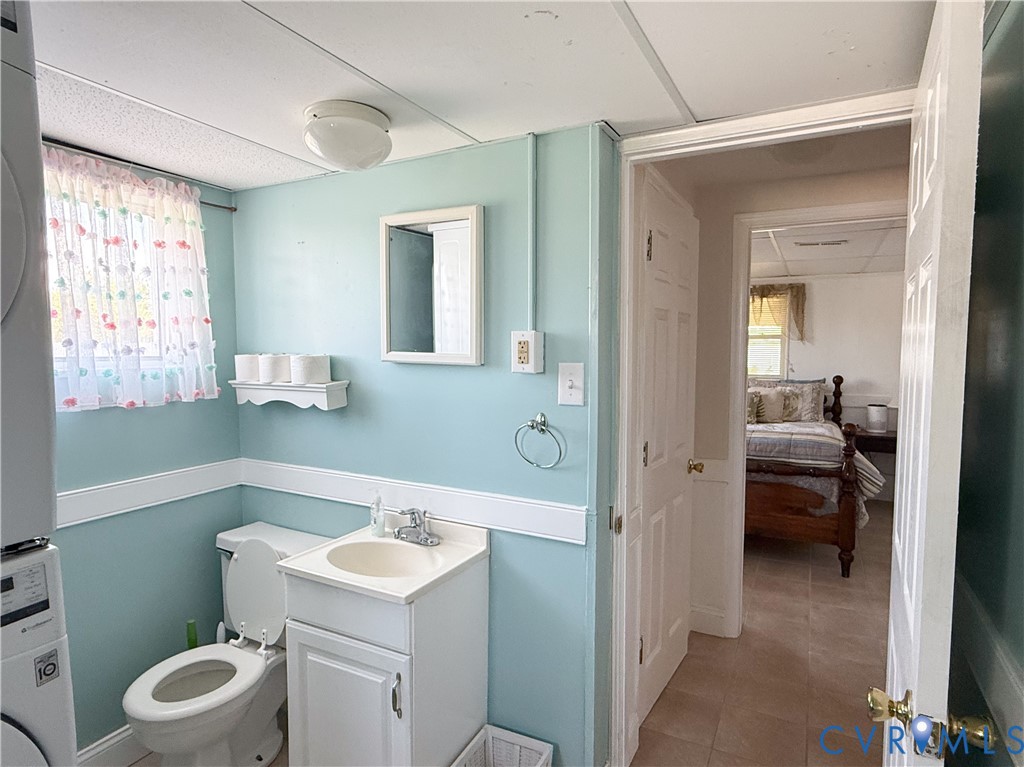 1280 Little Florida Road Farnham, VA 22460 - Photo 19 of 41 Bathroom featuring a single vanity, toilet, and wi